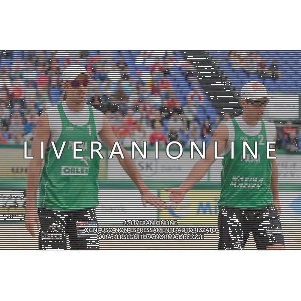 21.08.2014 - Stare Jablonki , siatkowka plazowa , beach volleyball , World Tour , FIVB Stare Jablonki Grand Slam 2014 , Polska (zielone) - Rosja (niebieskie) , Poland - Russia N/Z Mariusz Prudel , Grzegorz Fijalek Fot. Mariusz Palczynski / MPAimages.com/NEWSPIX.PL --- Newspix.pl /Agenzia Aldo Liverani sas - ITALY ONLY - Polonia - Russia beach volley maschile, World Tour, FIVB Stare Jablonki Grande Slam 2014 *** Local Caption *** www.newspix.pl mail us: info@newspix.pl call us: 0048 022 23 22 222 --- Polish Picture Agency by Ringier Axel Springer Poland