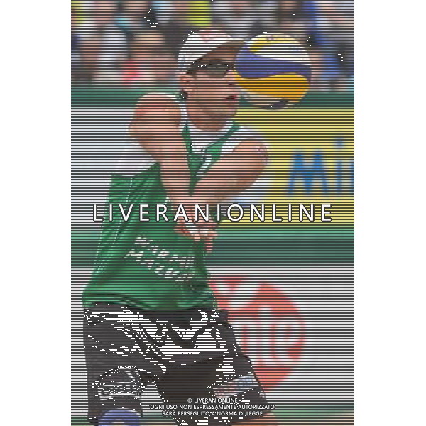 21.08.2014 - Stare Jablonki , siatkowka plazowa , beach volleyball , World Tour , FIVB Stare Jablonki Grand Slam 2014 , Polska (zielone) - Rosja (niebieskie) , Poland - Russia N/Z Grzegorz Fijalek Fot. Mariusz Palczynski / MPAimages.com/NEWSPIX.PL --- Newspix.pl /Agenzia Aldo Liverani sas - ITALY ONLY - Polonia - Russia beach volley maschile, World Tour, FIVB Stare Jablonki Grande Slam 2014 *** Local Caption *** www.newspix.pl mail us: info@newspix.pl call us: 0048 022 23 22 222 --- Polish Picture Agency by Ringier Axel Springer Poland