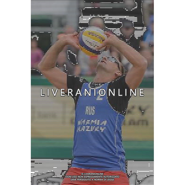 21.08.2014 - Stare Jablonki , siatkowka plazowa , beach volleyball , World Tour , FIVB Stare Jablonki Grand Slam 2014 , Polska (zielone) - Rosja (niebieskie) , Poland - Russia N/Z Nikita Liamin Fot. Mariusz Palczynski / MPAimages.com/NEWSPIX.PL --- Newspix.pl /Agenzia Aldo Liverani sas - ITALY ONLY - Polonia - Russia beach volley maschile, World Tour, FIVB Stare Jablonki Grande Slam 2014 *** Local Caption *** www.newspix.pl mail us: info@newspix.pl call us: 0048 022 23 22 222 --- Polish Picture Agency by Ringier Axel Springer Poland