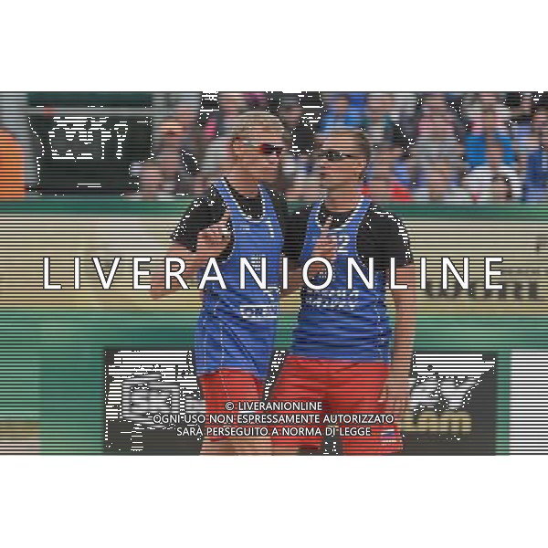 21.08.2014 - Stare Jablonki , siatkowka plazowa , beach volleyball , World Tour , FIVB Stare Jablonki Grand Slam 2014 , Polska (zielone) - Rosja (niebieskie) , Poland - Russia N/Z Dmitri Barsouk , Nikita Liamin Fot. Mariusz Palczynski / MPAimages.com/NEWSPIX.PL --- Newspix.pl /Agenzia Aldo Liverani sas - ITALY ONLY - Polonia - Russia beach volley maschile, World Tour, FIVB Stare Jablonki Grande Slam 2014 *** Local Caption *** www.newspix.pl mail us: info@newspix.pl call us: 0048 022 23 22 222 --- Polish Picture Agency by Ringier Axel Springer Poland