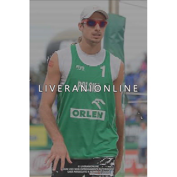 21.08.2014 - Stare Jablonki , siatkowka plazowa , beach volleyball , World Tour , FIVB Stare Jablonki Grand Slam 2014 , Polska (zielone) - Rosja (niebieskie) , Poland - Russia N/Z Mariusz Prudel Fot. Mariusz Palczynski / MPAimages.com/NEWSPIX.PL --- Newspix.pl /Agenzia Aldo Liverani sas - ITALY ONLY - Polonia - Russia beach volley maschile, World Tour, FIVB Stare Jablonki Grande Slam 2014 *** Local Caption *** www.newspix.pl mail us: info@newspix.pl call us: 0048 022 23 22 222 --- Polish Picture Agency by Ringier Axel Springer Poland