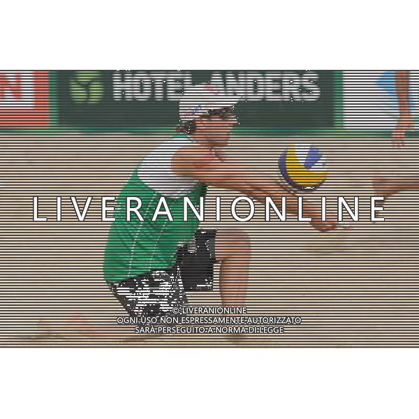 21.08.2014 - Stare Jablonki , siatkowka plazowa , beach volleyball , World Tour , FIVB Stare Jablonki Grand Slam 2014 , Polska (zielone) - Rosja (niebieskie) , Poland - Russia N/Z Grzegorz Fijalek Fot. Mariusz Palczynski / MPAimages.com/NEWSPIX.PL --- Newspix.pl /Agenzia Aldo Liverani sas - ITALY ONLY - Polonia - Russia beach volley maschile, World Tour, FIVB Stare Jablonki Grande Slam 2014 *** Local Caption *** www.newspix.pl mail us: info@newspix.pl call us: 0048 022 23 22 222 --- Polish Picture Agency by Ringier Axel Springer Poland