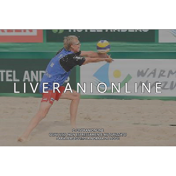 21.08.2014 - Stare Jablonki , siatkowka plazowa , beach volleyball , World Tour , FIVB Stare Jablonki Grand Slam 2014 , Polska (zielone) - Rosja (niebieskie) , Poland - Russia N/Z Dmitri Barsouk Fot. Mariusz Palczynski / MPAimages.com/NEWSPIX.PL --- Newspix.pl /Agenzia Aldo Liverani sas - ITALY ONLY - Polonia - Russia beach volley maschile, World Tour, FIVB Stare Jablonki Grande Slam 2014 *** Local Caption *** www.newspix.pl mail us: info@newspix.pl call us: 0048 022 23 22 222 --- Polish Picture Agency by Ringier Axel Springer Poland