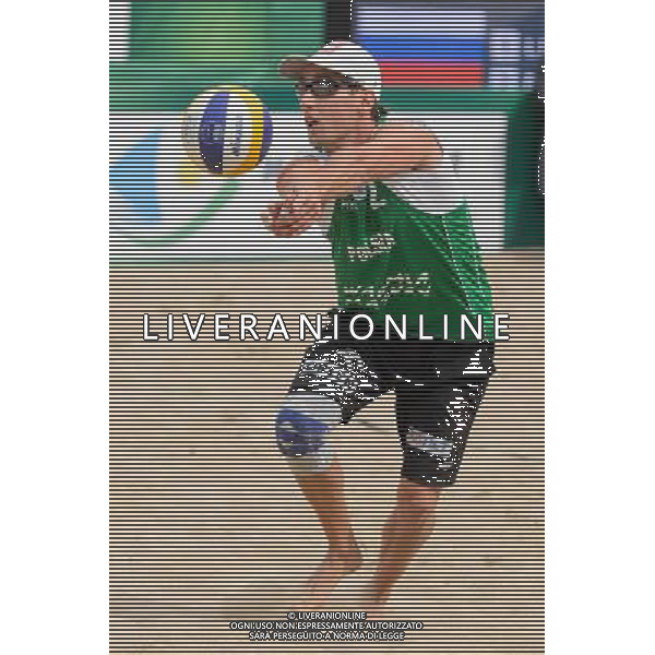 21.08.2014 - Stare Jablonki , siatkowka plazowa , beach volleyball , World Tour , FIVB Stare Jablonki Grand Slam 2014 , Polska (zielone) - Rosja (niebieskie) , Poland - Russia N/Z Grzegorz Fijalek Fot. Mariusz Palczynski / MPAimages.com/NEWSPIX.PL --- Newspix.pl /Agenzia Aldo Liverani sas - ITALY ONLY - Polonia - Russia beach volley maschile, World Tour, FIVB Stare Jablonki Grande Slam 2014 *** Local Caption *** www.newspix.pl mail us: info@newspix.pl call us: 0048 022 23 22 222 --- Polish Picture Agency by Ringier Axel Springer Poland