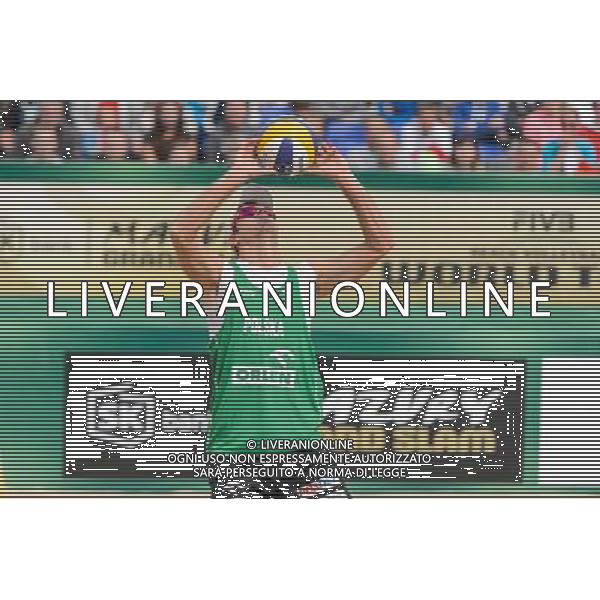 21.08.2014 - Stare Jablonki , siatkowka plazowa , beach volleyball , World Tour , FIVB Stare Jablonki Grand Slam 2014 , Polska (zielone) - Rosja (niebieskie) , Poland - Russia N/Z Mariusz Prudel Fot. Mariusz Palczynski / MPAimages.com/NEWSPIX.PL --- Newspix.pl /Agenzia Aldo Liverani sas - ITALY ONLY - Polonia - Russia beach volley maschile, World Tour, FIVB Stare Jablonki Grande Slam 2014 *** Local Caption *** www.newspix.pl mail us: info@newspix.pl call us: 0048 022 23 22 222 --- Polish Picture Agency by Ringier Axel Springer Poland