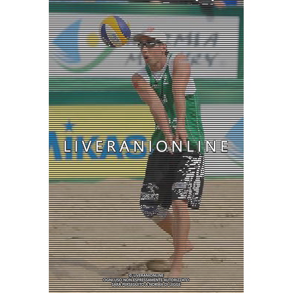 21.08.2014 - Stare Jablonki , siatkowka plazowa , beach volleyball , World Tour , FIVB Stare Jablonki Grand Slam 2014 , Polska (zielone) - Rosja (niebieskie) , Poland - Russia N/Z Grzegorz Fijalek Fot. Mariusz Palczynski / MPAimages.com/NEWSPIX.PL --- Newspix.pl /Agenzia Aldo Liverani sas - ITALY ONLY - Polonia - Russia beach volley maschile, World Tour, FIVB Stare Jablonki Grande Slam 2014 *** Local Caption *** www.newspix.pl mail us: info@newspix.pl call us: 0048 022 23 22 222 --- Polish Picture Agency by Ringier Axel Springer Poland