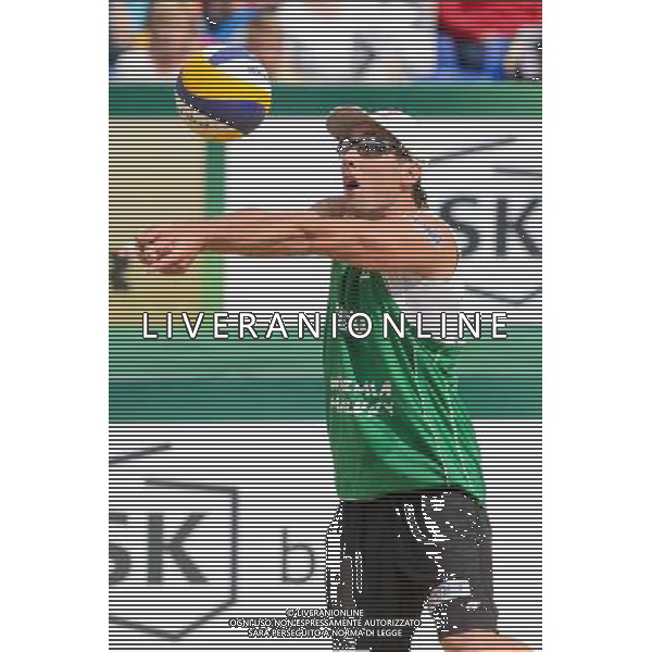 21.08.2014 - Stare Jablonki , siatkowka plazowa , beach volleyball , World Tour , FIVB Stare Jablonki Grand Slam 2014 , Polska (zielone) - Rosja (niebieskie) , Poland - Russia N/Z Grzegorz Fijalek Fot. Mariusz Palczynski / MPAimages.com/NEWSPIX.PL --- Newspix.pl /Agenzia Aldo Liverani sas - ITALY ONLY - Polonia - Russia beach volley maschile, World Tour, FIVB Stare Jablonki Grande Slam 2014 *** Local Caption *** www.newspix.pl mail us: info@newspix.pl call us: 0048 022 23 22 222 --- Polish Picture Agency by Ringier Axel Springer Poland