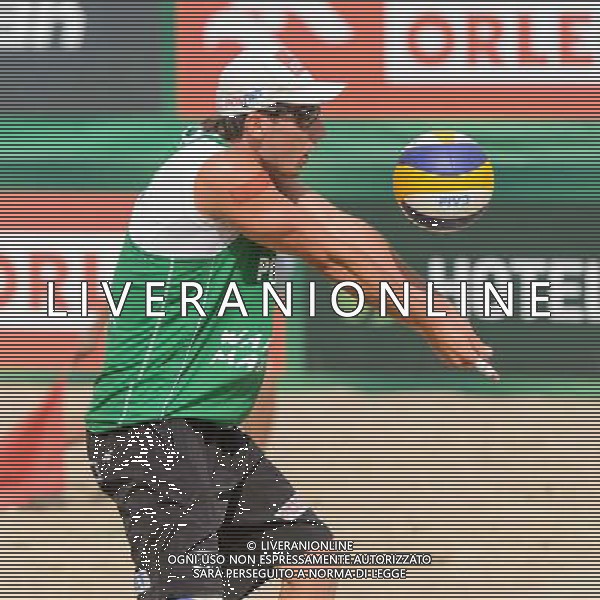 21.08.2014 - Stare Jablonki , siatkowka plazowa , beach volleyball , World Tour , FIVB Stare Jablonki Grand Slam 2014 , Polska (zielone) - Rosja (niebieskie) , Poland - Russia N/Z Grzegorz Fijalek Fot. Mariusz Palczynski / MPAimages.com/NEWSPIX.PL --- Newspix.pl /Agenzia Aldo Liverani sas - ITALY ONLY - Polonia - Russia beach volley maschile, World Tour, FIVB Stare Jablonki Grande Slam 2014 *** Local Caption *** www.newspix.pl mail us: info@newspix.pl call us: 0048 022 23 22 222 --- Polish Picture Agency by Ringier Axel Springer Poland