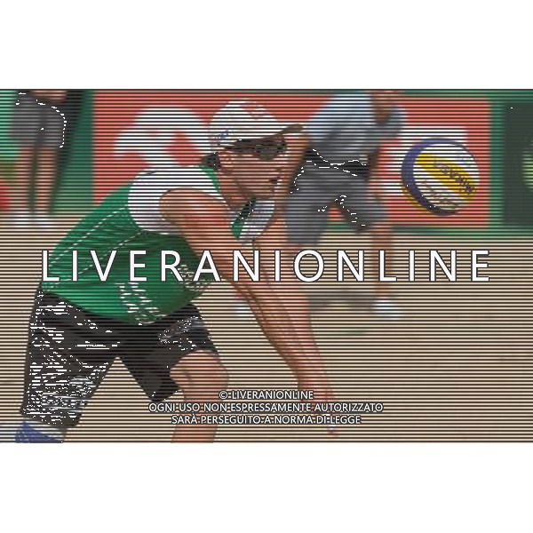 21.08.2014 - Stare Jablonki , siatkowka plazowa , beach volleyball , World Tour , FIVB Stare Jablonki Grand Slam 2014 , Polska (zielone) - Rosja (niebieskie) , Poland - Russia N/Z Grzegorz Fijalek Fot. Mariusz Palczynski / MPAimages.com/NEWSPIX.PL --- Newspix.pl /Agenzia Aldo Liverani sas - ITALY ONLY - Polonia - Russia beach volley maschile, World Tour, FIVB Stare Jablonki Grande Slam 2014 *** Local Caption *** www.newspix.pl mail us: info@newspix.pl call us: 0048 022 23 22 222 --- Polish Picture Agency by Ringier Axel Springer Poland