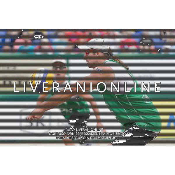 21.08.2014 - Stare Jablonki , siatkowka plazowa , beach volleyball , World Tour , FIVB Stare Jablonki Grand Slam 2014 , Polska (zielone) - Rosja (niebieskie) , Poland - Russia N/Z Mariusz Prudel Fot. Mariusz Palczynski / MPAimages.com/NEWSPIX.PL --- Newspix.pl /Agenzia Aldo Liverani sas - ITALY ONLY - Polonia - Russia beach volley maschile, World Tour, FIVB Stare Jablonki Grande Slam 2014 *** Local Caption *** www.newspix.pl mail us: info@newspix.pl call us: 0048 022 23 22 222 --- Polish Picture Agency by Ringier Axel Springer Poland