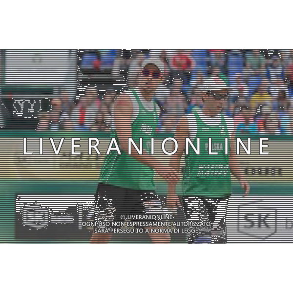 21.08.2014 - Stare Jablonki , siatkowka plazowa , beach volleyball , World Tour , FIVB Stare Jablonki Grand Slam 2014 , Polska (zielone) - Rosja (niebieskie) , Poland - Russia N/Z Mariusz Prudel , Grzegorz Fijalek Fot. Mariusz Palczynski / MPAimages.com/NEWSPIX.PL --- Newspix.pl /Agenzia Aldo Liverani sas - ITALY ONLY - Polonia - Russia beach volley maschile, World Tour, FIVB Stare Jablonki Grande Slam 2014 *** Local Caption *** www.newspix.pl mail us: info@newspix.pl call us: 0048 022 23 22 222 --- Polish Picture Agency by Ringier Axel Springer Poland