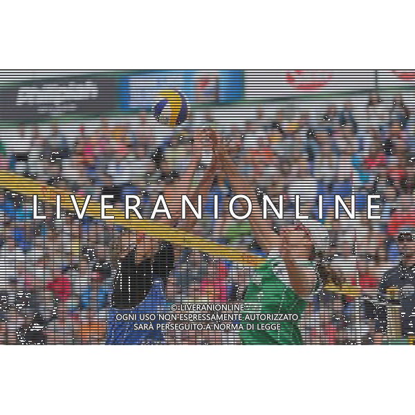21.08.2014 - Stare Jablonki , siatkowka plazowa , beach volleyball , World Tour , FIVB Stare Jablonki Grand Slam 2014 , Polska (zielone) - Rosja (niebieskie) , Poland - Russia N/Z Dmitri Barsouk , Mariusz Prudel Fot. Mariusz Palczynski / MPAimages.com/NEWSPIX.PL --- Newspix.pl /Agenzia Aldo Liverani sas - ITALY ONLY - Polonia - Russia beach volley maschile, World Tour, FIVB Stare Jablonki Grande Slam 2014 *** Local Caption *** www.newspix.pl mail us: info@newspix.pl call us: 0048 022 23 22 222 --- Polish Picture Agency by Ringier Axel Springer Poland