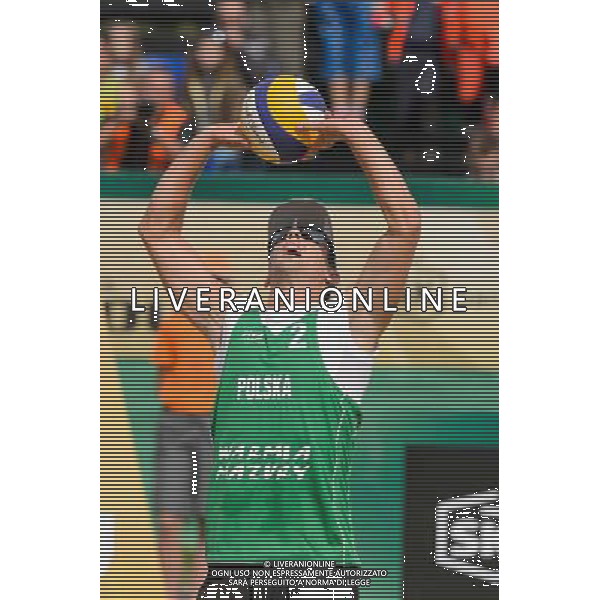 21.08.2014 - Stare Jablonki , siatkowka plazowa , beach volleyball , World Tour , FIVB Stare Jablonki Grand Slam 2014 , Polska (zielone) - Rosja (niebieskie) , Poland - Russia N/Z Grzegorz Fijalek Fot. Mariusz Palczynski / MPAimages.com/NEWSPIX.PL --- Newspix.pl /Agenzia Aldo Liverani sas - ITALY ONLY - Polonia - Russia beach volley maschile, World Tour, FIVB Stare Jablonki Grande Slam 2014 *** Local Caption *** www.newspix.pl mail us: info@newspix.pl call us: 0048 022 23 22 222 --- Polish Picture Agency by Ringier Axel Springer Poland