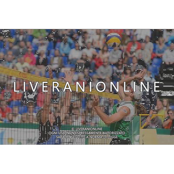 21.08.2014 - Stare Jablonki , siatkowka plazowa , beach volleyball , World Tour , FIVB Stare Jablonki Grand Slam 2014 , Polska (zielone) - Rosja (niebieskie) , Poland - Russia N/Z Dmitri Barsouk , Mariusz Prudel Fot. Mariusz Palczynski / MPAimages.com/NEWSPIX.PL --- Newspix.pl /Agenzia Aldo Liverani sas - ITALY ONLY - Polonia - Russia beach volley maschile, World Tour, FIVB Stare Jablonki Grande Slam 2014 *** Local Caption *** www.newspix.pl mail us: info@newspix.pl call us: 0048 022 23 22 222 --- Polish Picture Agency by Ringier Axel Springer Poland