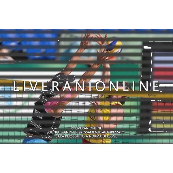 21.08.2014 - Stare Jablonki , siatkowka plazowa , beach volleyball , World Tour , FIVB Stare Jablonki Grand Slam 2014 , Polska (czarne) - Niemcy (zolte) , Poland - Germany N/Z Michal Kadziola , Thomas Kaczmarek Fot. Mariusz Palczynski / MPAimages.com/NEWSPIX.PL --- Newspix.pl /Agenzia Aldo Liverani sas - ITALY ONLY - Polonia - Germania beach volley maschile, World Tour, FIVB Stare Jablonki Grande Slam 2014 *** Local Caption *** www.newspix.pl mail us: info@newspix.pl call us: 0048 022 23 22 222 --- Polish Picture Agency by Ringier Axel Springer Poland