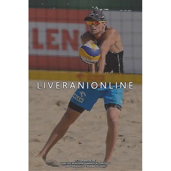 21.08.2014 - Stare Jablonki , siatkowka plazowa , beach volleyball , World Tour , FIVB Stare Jablonki Grand Slam 2014 , Polska (czarne) - Niemcy (zolte) , Poland - Germany N/Z Jakub Szalankiewicz Fot. Mariusz Palczynski / MPAimages.com/NEWSPIX.PL --- Newspix.pl /Agenzia Aldo Liverani sas - ITALY ONLY - Polonia - Germania beach volley maschile, World Tour, FIVB Stare Jablonki Grande Slam 2014 *** Local Caption *** www.newspix.pl mail us: info@newspix.pl call us: 0048 022 23 22 222 --- Polish Picture Agency by Ringier Axel Springer Poland
