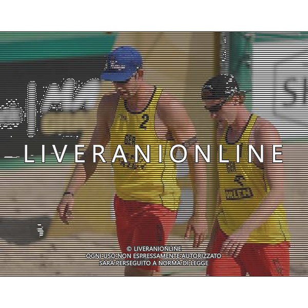 21.08.2014 - Stare Jablonki , siatkowka plazowa , beach volleyball , World Tour , FIVB Stare Jablonki Grand Slam 2014 , Polska (czarne) - Niemcy (zolte) , Poland - Germany N/Z Sebastian Fuchs , Thomas Kaczmarek Fot. Mariusz Palczynski / MPAimages.com/NEWSPIX.PL --- Newspix.pl /Agenzia Aldo Liverani sas - ITALY ONLY - Polonia - Germania beach volley maschile, World Tour, FIVB Stare Jablonki Grande Slam 2014 *** Local Caption *** www.newspix.pl mail us: info@newspix.pl call us: 0048 022 23 22 222 --- Polish Picture Agency by Ringier Axel Springer Poland