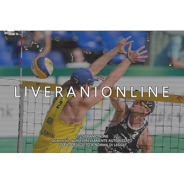 21.08.2014 - Stare Jablonki , siatkowka plazowa , beach volleyball , World Tour , FIVB Stare Jablonki Grand Slam 2014 , Polska (czarne) - Niemcy (zolte) , Poland - Germany N/Z Sebastian Fuchs , Jakub Szalankiewicz Fot. Mariusz Palczynski / MPAimages.com/NEWSPIX.PL --- Newspix.pl /Agenzia Aldo Liverani sas - ITALY ONLY - Polonia - Germania beach volley maschile, World Tour, FIVB Stare Jablonki Grande Slam 2014 *** Local Caption *** www.newspix.pl mail us: info@newspix.pl call us: 0048 022 23 22 222 --- Polish Picture Agency by Ringier Axel Springer Poland