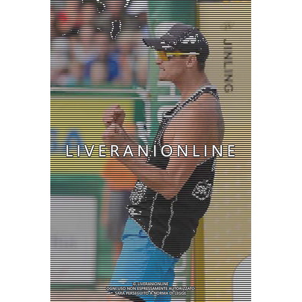 21.08.2014 - Stare Jablonki , siatkowka plazowa , beach volleyball , World Tour , FIVB Stare Jablonki Grand Slam 2014 , Polska (czarne) - Niemcy (zolte) , Poland - Germany N/Z Jakub Szalankiewicz Fot. Mariusz Palczynski / MPAimages.com/NEWSPIX.PL --- Newspix.pl /Agenzia Aldo Liverani sas - ITALY ONLY - Polonia - Germania beach volley maschile, World Tour, FIVB Stare Jablonki Grande Slam 2014 *** Local Caption *** www.newspix.pl mail us: info@newspix.pl call us: 0048 022 23 22 222 --- Polish Picture Agency by Ringier Axel Springer Poland
