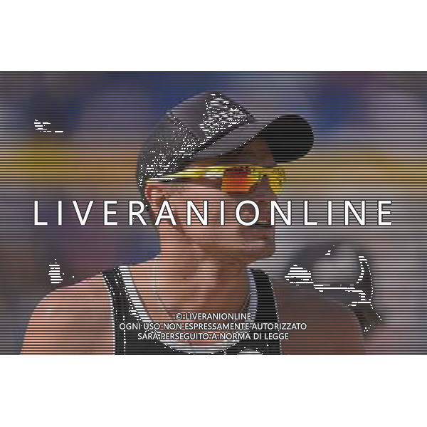 21.08.2014 - Stare Jablonki , siatkowka plazowa , beach volleyball , World Tour , FIVB Stare Jablonki Grand Slam 2014 , Polska (czarne) - Niemcy (zolte) , Poland - Germany N/Z Jakub Szalankiewicz Fot. Mariusz Palczynski / MPAimages.com/NEWSPIX.PL --- Newspix.pl /Agenzia Aldo Liverani sas - ITALY ONLY - Polonia - Germania beach volley maschile, World Tour, FIVB Stare Jablonki Grande Slam 2014 *** Local Caption *** www.newspix.pl mail us: info@newspix.pl call us: 0048 022 23 22 222 --- Polish Picture Agency by Ringier Axel Springer Poland