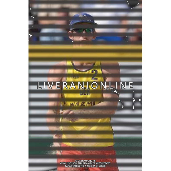 21.08.2014 - Stare Jablonki , siatkowka plazowa , beach volleyball , World Tour , FIVB Stare Jablonki Grand Slam 2014 , Polska (czarne) - Niemcy (zolte) , Poland - Germany N/Z Sebastian Fuchs Fot. Mariusz Palczynski / MPAimages.com/NEWSPIX.PL --- Newspix.pl /Agenzia Aldo Liverani sas - ITALY ONLY - Polonia - Germania beach volley maschile, World Tour, FIVB Stare Jablonki Grande Slam 2014 *** Local Caption *** www.newspix.pl mail us: info@newspix.pl call us: 0048 022 23 22 222 --- Polish Picture Agency by Ringier Axel Springer Poland