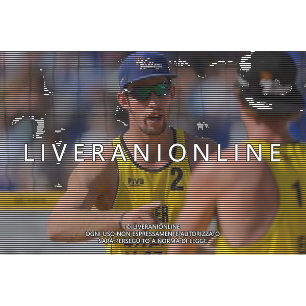 21.08.2014 - Stare Jablonki , siatkowka plazowa , beach volleyball , World Tour , FIVB Stare Jablonki Grand Slam 2014 , Polska (czarne) - Niemcy (zolte) , Poland - Germany N/Z Sebastian Fuchs Fot. Mariusz Palczynski / MPAimages.com/NEWSPIX.PL --- Newspix.pl /Agenzia Aldo Liverani sas - ITALY ONLY - Polonia - Germania beach volley maschile, World Tour, FIVB Stare Jablonki Grande Slam 2014 *** Local Caption *** www.newspix.pl mail us: info@newspix.pl call us: 0048 022 23 22 222 --- Polish Picture Agency by Ringier Axel Springer Poland