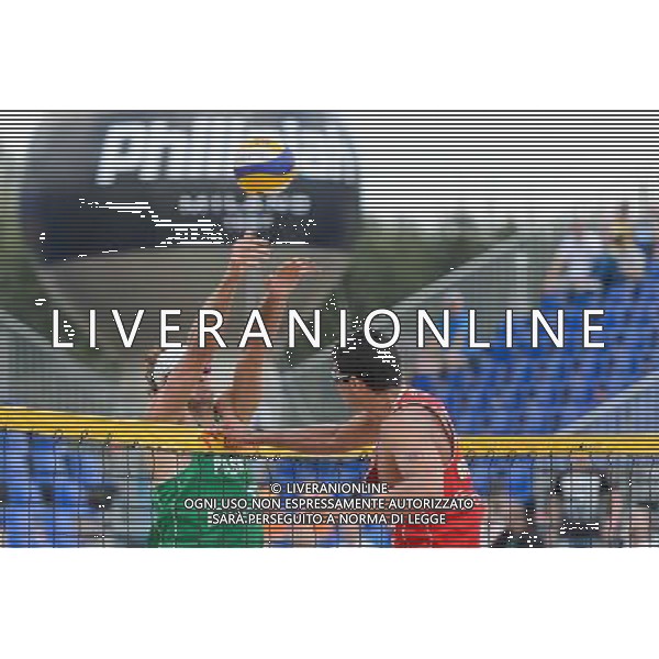 22.08.2014 - Stare Jablonki , siatkowka plazowa , beach volleyball , World Tour , FIVB Stare Jablonki Grand Slam 2014 , Polska (zielone) - Brazilia (czerwone) , Poland - Brazil N/Z Mariusz Prudel , Vitor Goncalves Felipe Fot. Mariusz Palczynski / MPAimages.com/NEWSPIX.PL --- Newspix.pl /Agenzia Aldo Liverani sas - ITALY ONLY - Polonia - Brasile beach volley maschile, World Tour, FIVB Stare Jablonki Grande Slam 2014 *** Local Caption *** www.newspix.pl mail us: info@newspix.pl call us: 0048 022 23 22 222 --- Polish Picture Agency by Ringier Axel Springer Poland
