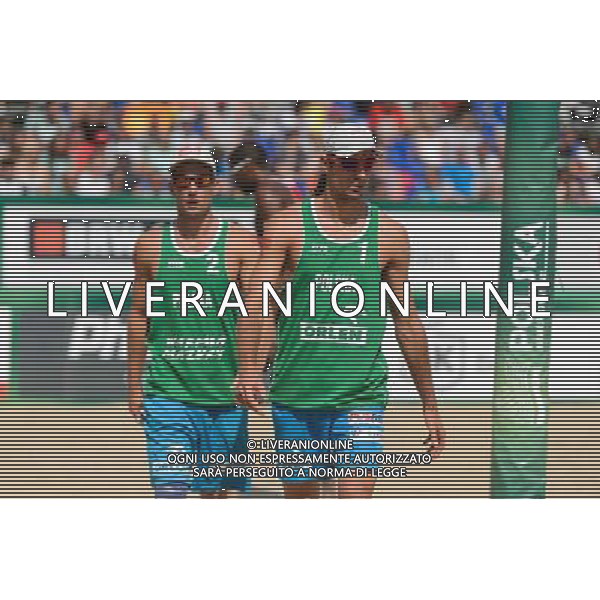 22.08.2014 - Stare Jablonki , siatkowka plazowa , beach volleyball , World Tour , FIVB Stare Jablonki Grand Slam 2014 , Polska (zielone) - Brazilia (czerwone) , Poland - Brazil N/Z Grzegorz Fijalek , Mariusz Prudel Fot. Mariusz Palczynski / MPAimages.com/NEWSPIX.PL --- Newspix.pl /Agenzia Aldo Liverani sas - ITALY ONLY - Polonia - Brasile beach volley maschile, World Tour, FIVB Stare Jablonki Grande Slam 2014 *** Local Caption *** www.newspix.pl mail us: info@newspix.pl call us: 0048 022 23 22 222 --- Polish Picture Agency by Ringier Axel Springer Poland