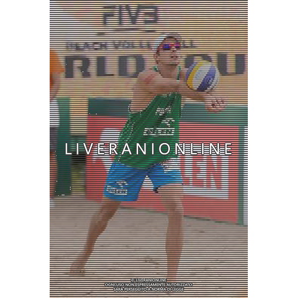 22.08.2014 - Stare Jablonki , siatkowka plazowa , beach volleyball , World Tour , FIVB Stare Jablonki Grand Slam 2014 , Polska (zielone) - Brazilia (czerwone) , Poland - Brazil N/Z Mariusz Prudel Fot. Mariusz Palczynski / MPAimages.com/NEWSPIX.PL --- Newspix.pl /Agenzia Aldo Liverani sas - ITALY ONLY - Polonia - Brasile beach volley maschile, World Tour, FIVB Stare Jablonki Grande Slam 2014 *** Local Caption *** www.newspix.pl mail us: info@newspix.pl call us: 0048 022 23 22 222 --- Polish Picture Agency by Ringier Axel Springer Poland