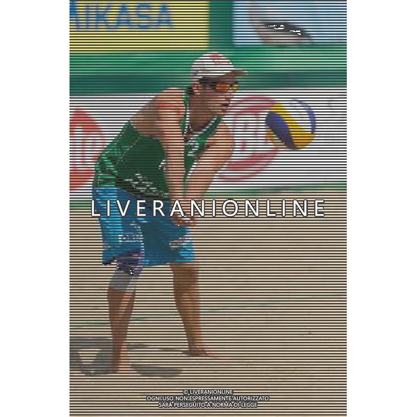 22.08.2014 - Stare Jablonki , siatkowka plazowa , beach volleyball , World Tour , FIVB Stare Jablonki Grand Slam 2014 , Polska (zielone) - Brazilia (czerwone) , Poland - Brazil N/Z Grzegorz Fijalek Fot. Mariusz Palczynski / MPAimages.com/NEWSPIX.PL --- Newspix.pl /Agenzia Aldo Liverani sas - ITALY ONLY - Polonia - Brasile beach volley maschile, World Tour, FIVB Stare Jablonki Grande Slam 2014 *** Local Caption *** www.newspix.pl mail us: info@newspix.pl call us: 0048 022 23 22 222 --- Polish Picture Agency by Ringier Axel Springer Poland