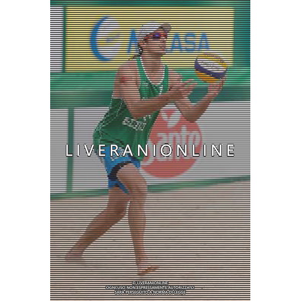 22.08.2014 - Stare Jablonki , siatkowka plazowa , beach volleyball , World Tour , FIVB Stare Jablonki Grand Slam 2014 , Polska (zielone) - Brazilia (czerwone) , Poland - Brazil N/Z Mariusz Prudel Fot. Mariusz Palczynski / MPAimages.com/NEWSPIX.PL --- Newspix.pl /Agenzia Aldo Liverani sas - ITALY ONLY - Polonia - Brasile beach volley maschile, World Tour, FIVB Stare Jablonki Grande Slam 2014 *** Local Caption *** www.newspix.pl mail us: info@newspix.pl call us: 0048 022 23 22 222 --- Polish Picture Agency by Ringier Axel Springer Poland