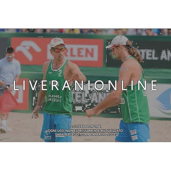 22.08.2014 - Stare Jablonki , siatkowka plazowa , beach volleyball , World Tour , FIVB Stare Jablonki Grand Slam 2014 , Polska (zielone) - Brazilia (czerwone) , Poland - Brazil N/Z Grzegorz Fijalek , Mariusz Prudel Fot. Mariusz Palczynski / MPAimages.com/NEWSPIX.PL --- Newspix.pl /Agenzia Aldo Liverani sas - ITALY ONLY - Polonia - Brasile beach volley maschile, World Tour, FIVB Stare Jablonki Grande Slam 2014 *** Local Caption *** www.newspix.pl mail us: info@newspix.pl call us: 0048 022 23 22 222 --- Polish Picture Agency by Ringier Axel Springer Poland