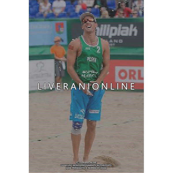 22.08.2014 - Stare Jablonki , siatkowka plazowa , beach volleyball , World Tour , FIVB Stare Jablonki Grand Slam 2014 , Polska (zielone) - Brazilia (czerwone) , Poland - Brazil N/Z Grzegorz Fijalek Fot. Mariusz Palczynski / MPAimages.com/NEWSPIX.PL --- Newspix.pl /Agenzia Aldo Liverani sas - ITALY ONLY - Polonia - Brasile beach volley maschile, World Tour, FIVB Stare Jablonki Grande Slam 2014 *** Local Caption *** www.newspix.pl mail us: info@newspix.pl call us: 0048 022 23 22 222 --- Polish Picture Agency by Ringier Axel Springer Poland
