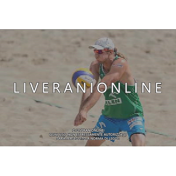 22.08.2014 - Stare Jablonki , siatkowka plazowa , beach volleyball , World Tour , FIVB Stare Jablonki Grand Slam 2014 , Polska (zielone) - Brazilia (czerwone) , Poland - Brazil N/Z Mariusz Prudel Fot. Mariusz Palczynski / MPAimages.com/NEWSPIX.PL --- Newspix.pl /Agenzia Aldo Liverani sas - ITALY ONLY - Polonia - Brasile beach volley maschile, World Tour, FIVB Stare Jablonki Grande Slam 2014 *** Local Caption *** www.newspix.pl mail us: info@newspix.pl call us: 0048 022 23 22 222 --- Polish Picture Agency by Ringier Axel Springer Poland