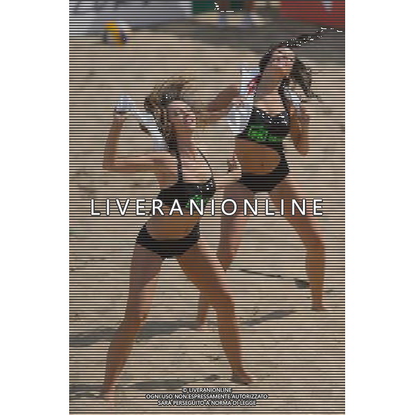 22.08.2014 - Stare Jablonki , siatkowka plazowa , beach volleyball , World Tour , FIVB Stare Jablonki Grand Slam 2014 , Polska (zielone) - Brazilia (czerwone) , Poland - Brazil N/Z Cheerleaders Flex Sopot Fot. Mariusz Palczynski / MPAimages.com/NEWSPIX.PL --- Newspix.pl /Agenzia Aldo Liverani sas - ITALY ONLY - Polonia - Brasile beach volley maschile, World Tour, FIVB Stare Jablonki Grande Slam 2014 *** Local Caption *** www.newspix.pl mail us: info@newspix.pl call us: 0048 022 23 22 222 --- Polish Picture Agency by Ringier Axel Springer Poland