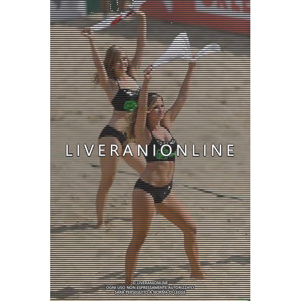 22.08.2014 - Stare Jablonki , siatkowka plazowa , beach volleyball , World Tour , FIVB Stare Jablonki Grand Slam 2014 , Polska (zielone) - Brazilia (czerwone) , Poland - Brazil N/Z Cheerleaders Flex Sopot Fot. Mariusz Palczynski / MPAimages.com/NEWSPIX.PL --- Newspix.pl /Agenzia Aldo Liverani sas - ITALY ONLY - Polonia - Brasile beach volley maschile, World Tour, FIVB Stare Jablonki Grande Slam 2014 *** Local Caption *** www.newspix.pl mail us: info@newspix.pl call us: 0048 022 23 22 222 --- Polish Picture Agency by Ringier Axel Springer Poland