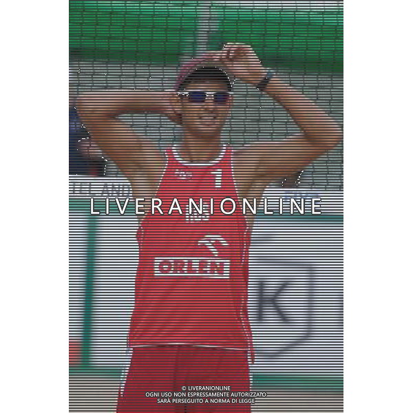 22.08.2014 - Stare Jablonki , siatkowka plazowa , beach volleyball , World Tour , FIVB Stare Jablonki Grand Slam 2014 , Hiszpania (biale) - Rosja (czerwone) , Spain (white) - Russia (red) N/Z Konstantin Semenov Fot. Karol Bartnik / MPAimages.com/NEWSPIX.PL --- Newspix.pl /Agenzia Aldo Liverani sas - ITALY ONLY - Spagna - Russia beach volley maschile, World Tour, FIVB Stare Jablonki Grande Slam 2014 *** Local Caption *** www.newspix.pl mail us: info@newspix.pl call us: 0048 022 23 22 222 --- Polish Picture Agency by Ringier Axel Springer Poland