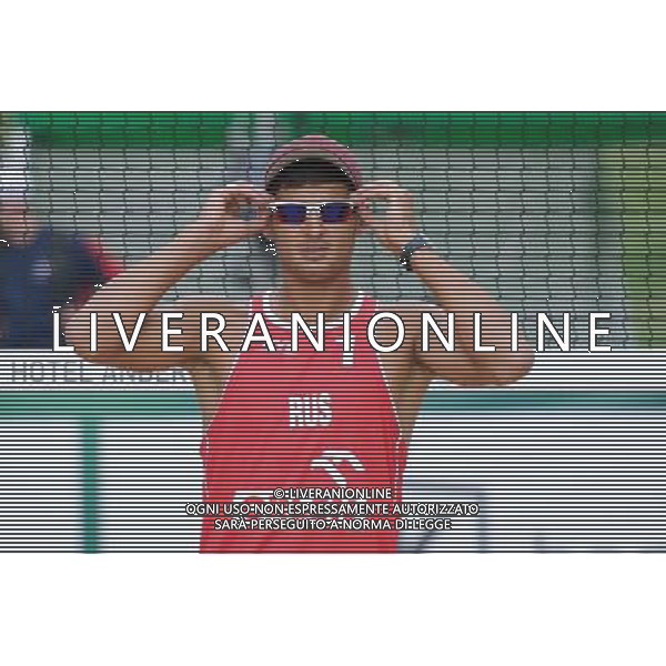 22.08.2014 - Stare Jablonki , siatkowka plazowa , beach volleyball , World Tour , FIVB Stare Jablonki Grand Slam 2014 , Hiszpania (biale) - Rosja (czerwone) , Spain (white) - Russia (red) N/Z Konstantin Semenov Fot. Karol Bartnik / MPAimages.com/NEWSPIX.PL --- Newspix.pl /Agenzia Aldo Liverani sas - ITALY ONLY - Spagna - Russia beach volley maschile, World Tour, FIVB Stare Jablonki Grande Slam 2014 *** Local Caption *** www.newspix.pl mail us: info@newspix.pl call us: 0048 022 23 22 222 --- Polish Picture Agency by Ringier Axel Springer Poland