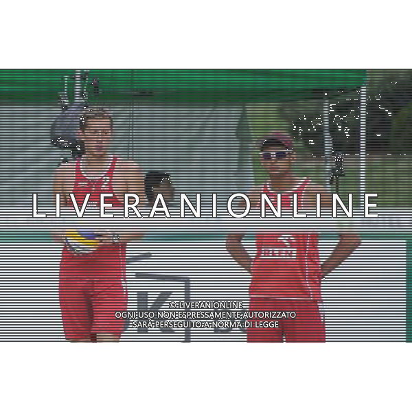 22.08.2014 - Stare Jablonki , siatkowka plazowa , beach volleyball , World Tour , FIVB Stare Jablonki Grand Slam 2014 , Hiszpania (biale) - Rosja (czerwone) , Spain (white) - Russia (red) N/Z Viacheslav Krasilnikov , Konstantin Semenov Fot. Karol Bartnik / MPAimages.com/NEWSPIX.PL --- Newspix.pl /Agenzia Aldo Liverani sas - ITALY ONLY - Spagna - Russia beach volley maschile, World Tour, FIVB Stare Jablonki Grande Slam 2014 *** Local Caption *** www.newspix.pl mail us: info@newspix.pl call us: 0048 022 23 22 222 --- Polish Picture Agency by Ringier Axel Springer Poland