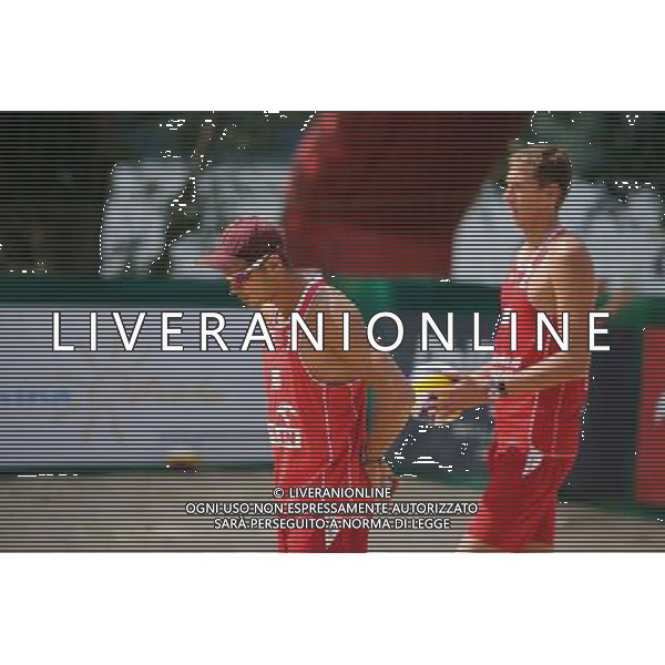 22.08.2014 - Stare Jablonki , siatkowka plazowa , beach volleyball , World Tour , FIVB Stare Jablonki Grand Slam 2014 , Hiszpania (biale) - Rosja (czerwone) , Spain (white) - Russia (red) N/Z Konstantin Semenov , Viacheslav Krasilnikov Fot. Karol Bartnik / MPAimages.com/NEWSPIX.PL --- Newspix.pl /Agenzia Aldo Liverani sas - ITALY ONLY - Spagna - Russia beach volley maschile, World Tour, FIVB Stare Jablonki Grande Slam 2014 *** Local Caption *** www.newspix.pl mail us: info@newspix.pl call us: 0048 022 23 22 222 --- Polish Picture Agency by Ringier Axel Springer Poland
