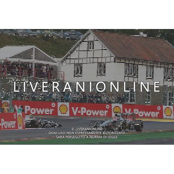 Jenson Button (GBR) McLaren MP4-29 leads team mate Kevin Magnussen (DEN) McLaren MP4-29. 23.08.2014. Formula 1 World Championship, Rd 12, Belgian Grand Prix, Spa Francorchamps, Belgium, Qualifying Day. AG ALDO LIVERANI SAS ONLY ITALY