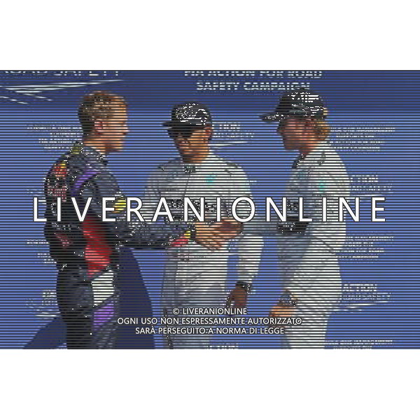 (L to R): Sebastian Vettel (GER) Red Bull Racing with Lewis Hamilton (GBR) Mercedes AMG F1 and pole sitter Nico Rosberg (GER) Mercedes AMG F1. 23.08.2014. Formula 1 World Championship, Rd 12, Belgian Grand Prix, Spa Francorchamps, Belgium, Qualifying Day. AG ALDO LIVERANI SAS ONLY ITALY