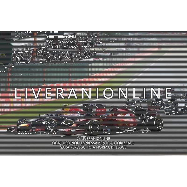 Fernando Alonso (ESP) Ferrari F14-T and Daniel Ricciardo (AUS) Red Bull Racing RB10 at the start of the race. 24.08.2014. Formula 1 World Championship, Rd 12, Belgian Grand Prix, Spa Francorchamps, Belgium, Race Day. AG ALDO LIVERANI SAS ONLY ITALY