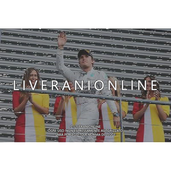 Nico Rosberg (GER) Mercedes AMG F1 celebrates his second position on the podium. 24.08.2014. Formula 1 World Championship, Rd 12, Belgian Grand Prix, Spa Francorchamps, Belgium, Race Day. AG ALDO LIVERANI SAS ONLY ITALY