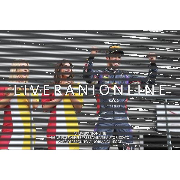 Race winner Daniel Ricciardo (AUS) Red Bull Racing celebrates on the podium. 24.08.2014. Formula 1 World Championship, Rd 12, Belgian Grand Prix, Spa Francorchamps, Belgium, Race Day. AG ALDO LIVERANI SAS ONLY ITALY