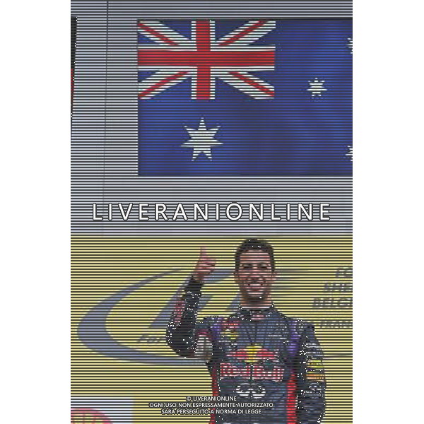 Race winner Daniel Ricciardo (AUS) Red Bull Racing celebrates on the podium. 24.08.2014. Formula 1 World Championship, Rd 12, Belgian Grand Prix, Spa Francorchamps, Belgium, Race Day. AG ALDO LIVERANI SAS ONLY ITALY