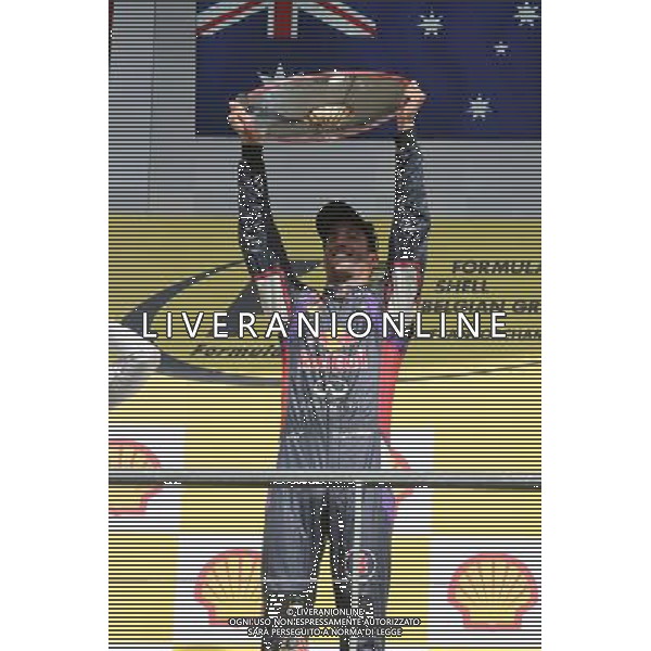 Race winner Daniel Ricciardo (AUS) Red Bull Racing celebrates on the podium. 24.08.2014. Formula 1 World Championship, Rd 12, Belgian Grand Prix, Spa Francorchamps, Belgium, Race Day. AG ALDO LIVERANI SAS ONLY ITALY