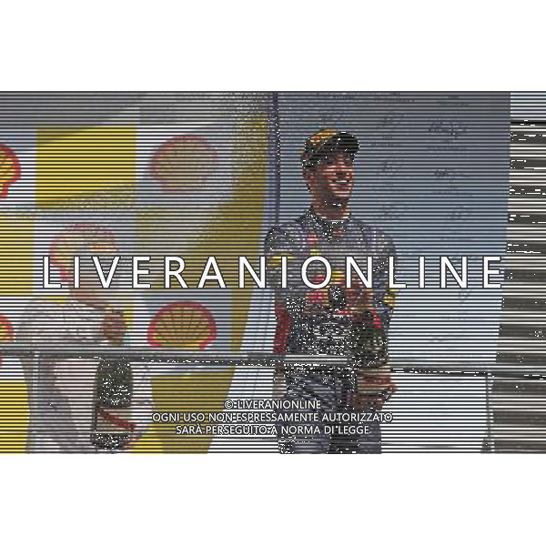 Race winner Daniel Ricciardo (AUS) Red Bull Racing celebrates on the podium. 24.08.2014. Formula 1 World Championship, Rd 12, Belgian Grand Prix, Spa Francorchamps, Belgium, Race Day. AG ALDO LIVERANI SAS ONLY ITALY