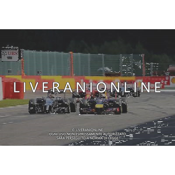 Kevin Magnussen (DEN), McLaren F1 and Sebastian Vettel (GER), Red Bull Racing 24.08.2014. Formula 1 World Championship, Rd 12, Belgian Grand Prix, Spa Francorchamps, Belgium, Race Day. AG ALDO LIVERANI SAS ONLY ITALY