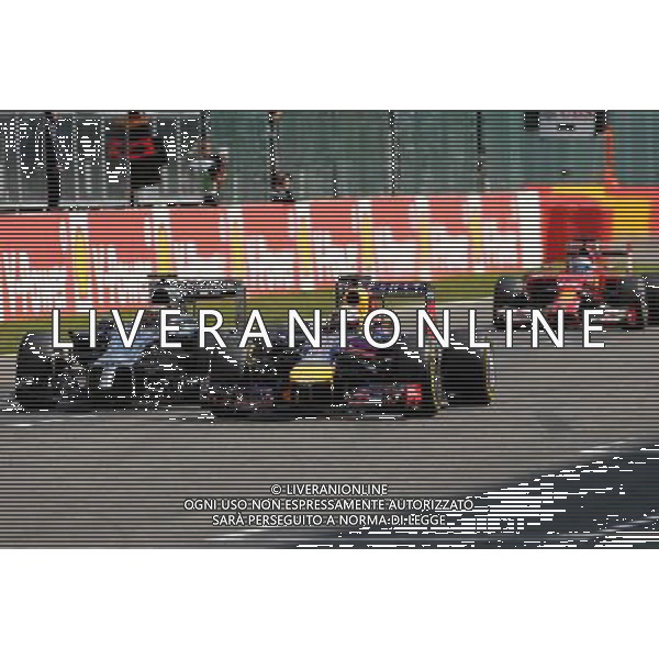 Sebastian Vettel (GER), Red Bull Racing and Kevin Magnussen (DEN), McLaren F1 24.08.2014. Formula 1 World Championship, Rd 12, Belgian Grand Prix, Spa Francorchamps, Belgium, Race Day. AG ALDO LIVERANI SAS ONLY ITALY